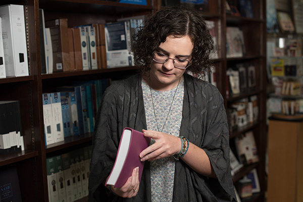 Woman Looking Through Book