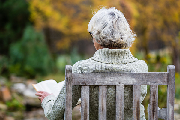 Woman Reading on the Patio