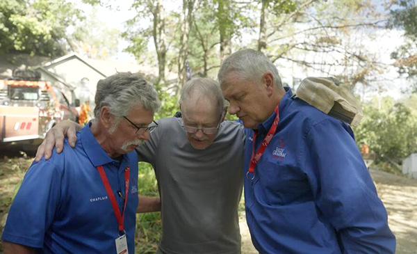 Billy Graham Chaplains Praying with Man