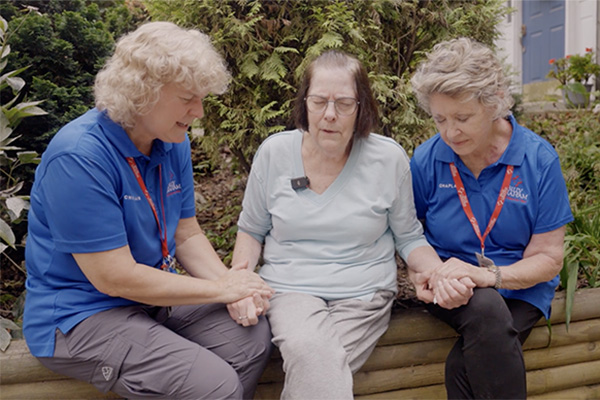 Two RRt Chaplains praying with Hurricane Helene Victim