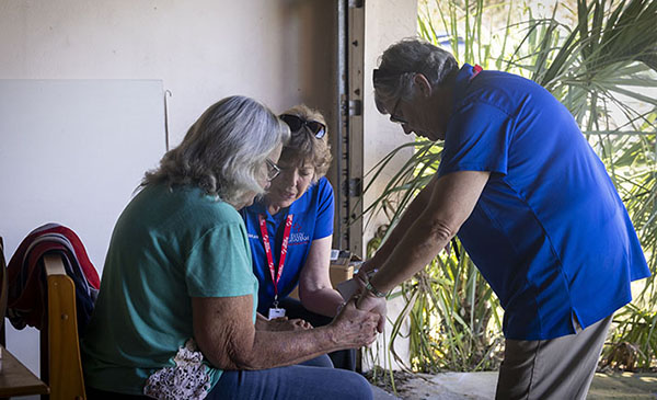 Billy Graham Chaplains Praying with Woman