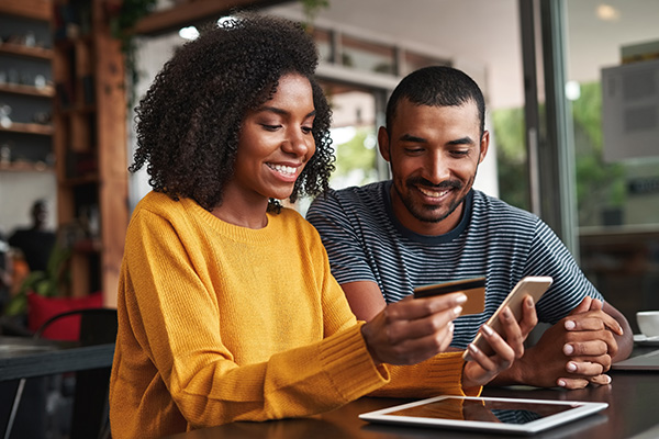 Couple Using Credit Card Online