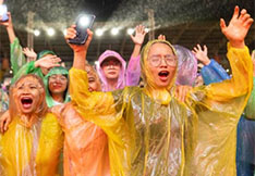 Crowd in Vietnam Praising God While Raining
