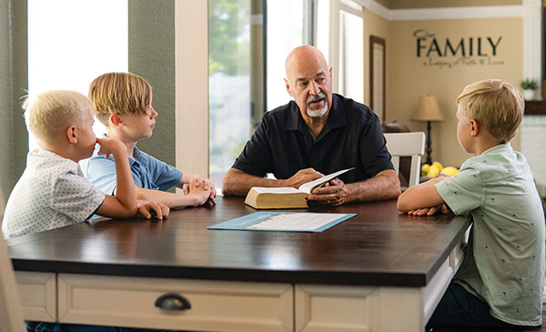 Children talking to Grandfather