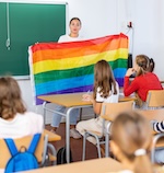 School Teacher Holding Rainbow Flag