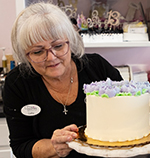 woman decorating cake