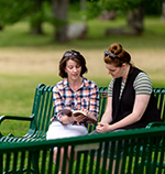 Woman Sharing with Another