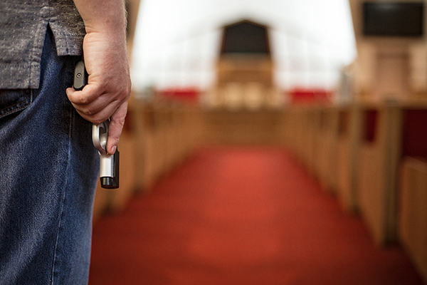 Person Holding a Gun in Church Person Holding a Gun in Church